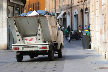 FERRARA, ITALY - June, 3, 2017: refuse truck in a center of Ferrara, Italy