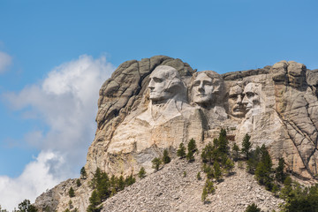 Side view of Mount Rushmore with sunlight - Powered by Adobe
