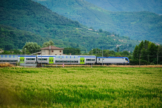 Rovigo, Italy - June, 14, 2017: train drives cross the filds near Monselice, Italy