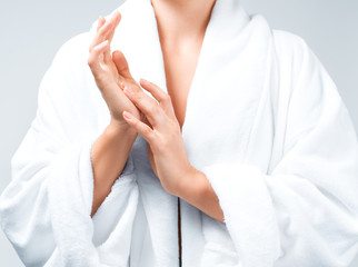Closeup beautiful woman after bath in white bathrobe