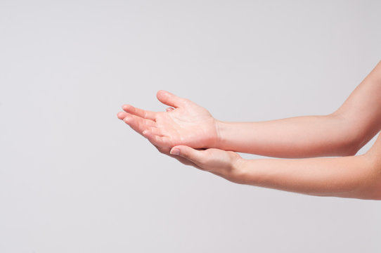 Female hands. Closeup of a woman's palms on white background