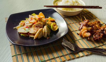 delicious spicy thai food of cooked rice and mix salad and hot dog with Fried pork.