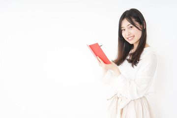 Young woman taking a note