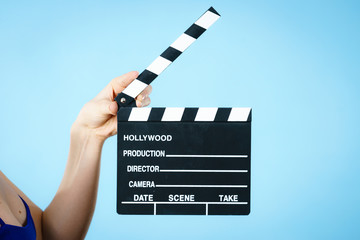 Woman holding professional film slate