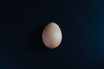 egg on the blackboard in the dark.