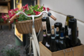 Decorative Bicycle with flowers and wine bottles
