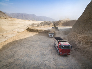 Aerial view of Earth moover heavy machines at work.