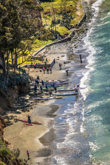 Overhead view of people with kayaks on the shoreline of Angel Island, a conservancy is San...