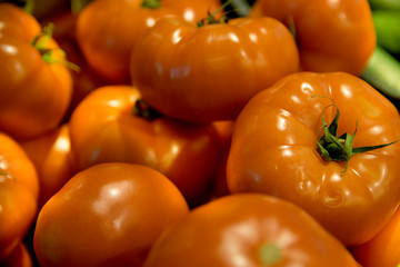 Fresh organic tomatoes as background. Close up