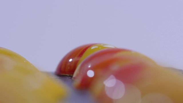 close up of two caramel candies on white background. Salted caramel pieces. Row of caramel candies on white background