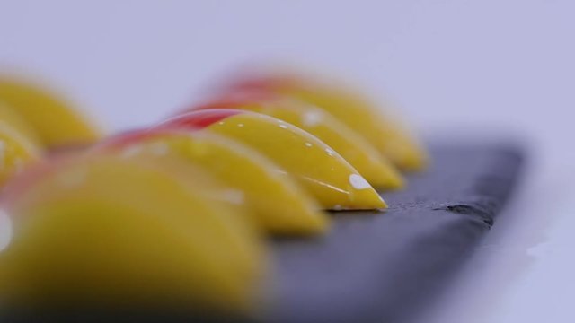 close up of two caramel candies on white background. Salted caramel pieces. Row of caramel candies on white background
