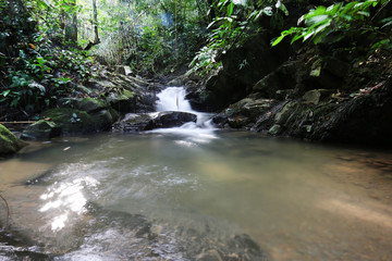 Naklejka na ściany i meble Tropical rainforest waterfall in Sabah Borneo, Malaysia
