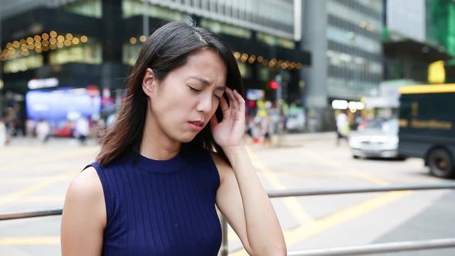 Woman suffer from headache at outdoor