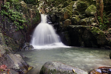 Fototapeta na wymiar Tropical rainforest waterfall in Sabah Borneo, Malaysia