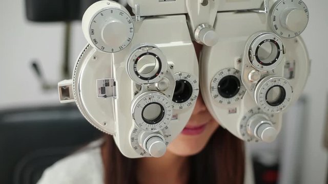 Woman doing eye test in clinic