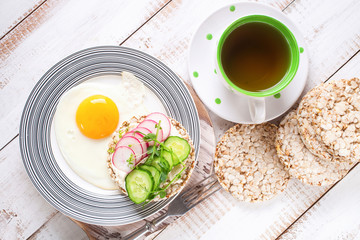 Toast with cheese, a cucumber and a garden radish