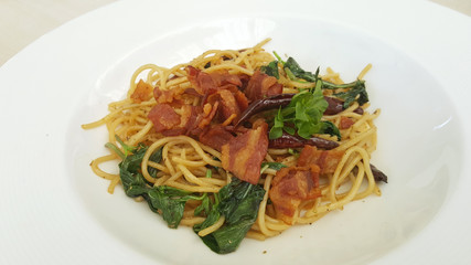 Bacon spaghetti on white plate