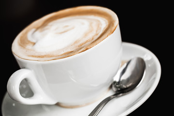 Cup of cappuccino. White mug with coffee