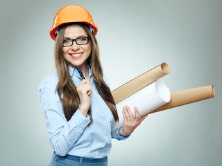 Student girl architect wearing glasses holding rolled up technical drawing.