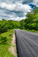 Asphalt road with yellow line