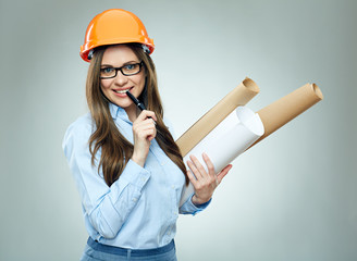 Student girl architect wearing glasses holding rolled up technical drawing.
