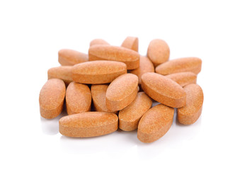 Vitamin C tablets on a white background