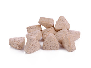 Vitamin E tablets on a white background