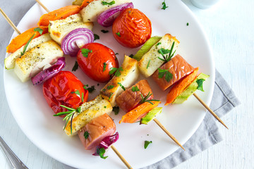 Grilled sausage and vegetables skewers