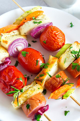 Grilled sausage and vegetables skewers