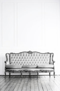 Black and white image of antique sofa in a retro interior. Vintage  background. Stock Photo | Adobe Stock