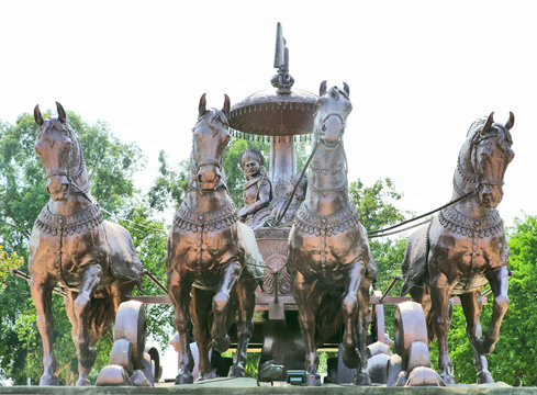 Giant Krishna-Arjuna chariot made of bronze metal, situated at Brahma Sarovar Kurukshetra, Haryana, is a big charm for the pilgrims.