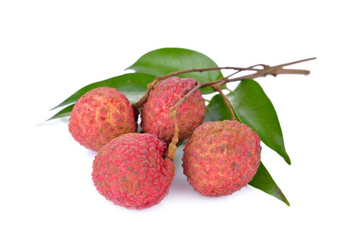 fresh Lychees with leaves and stem on white background