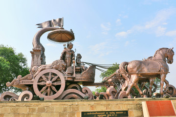 Giant Krishna-Arjuna chariot made of bronze metal, situated at Brahma Sarovar Kurukshetra, Haryana,...