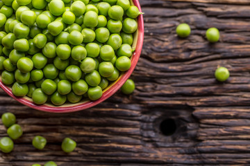 Peas. Fresh bio homemade peas and pods on old oak board. Healthy fresh green vegetable - peas and...