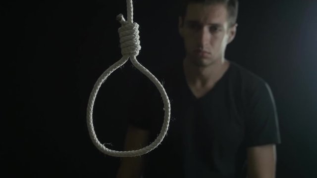 suicide. man on the background of the loop for the neck.