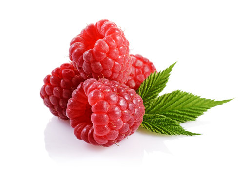 Healthy food. Close up view fresh ripe raspberry with leaves