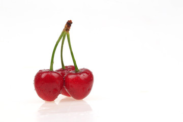 Fresh cherries on a white background