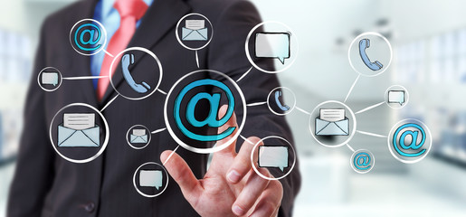 Businessman touching hand-drawn graph with contact and connections