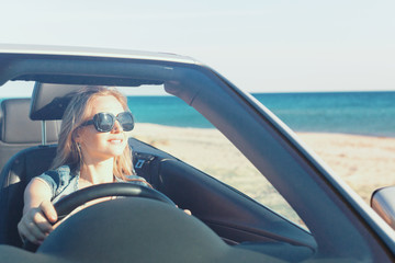 Relaxed happy woman traveling in a car