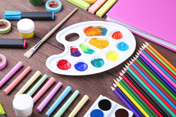 School supplies on brown wooden table