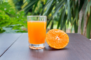 Composition of orange cut glass with juice