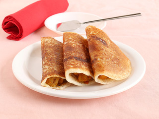 Masala dosa, a traditional and popular South Indian vegetarian food.
