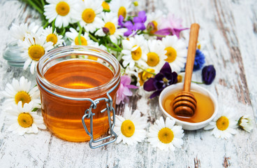 Fototapeta na wymiar Honey and wild flowers