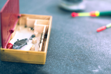 Fishing tackle on black background with blurred background.