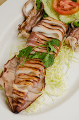 Grilled Squid on wood table