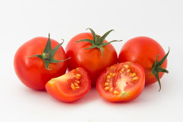 Fresh tomatoes isolated on white