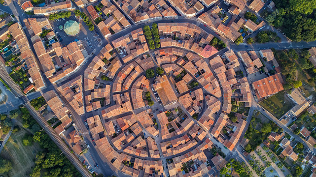 Aerial top view of Bram medieval village architecture and roofs from above, Southern France
