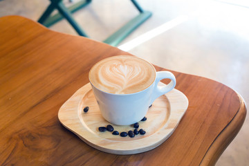 Coffee cup top view on wooden table background