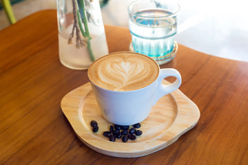 Coffee cup top view on wooden table background