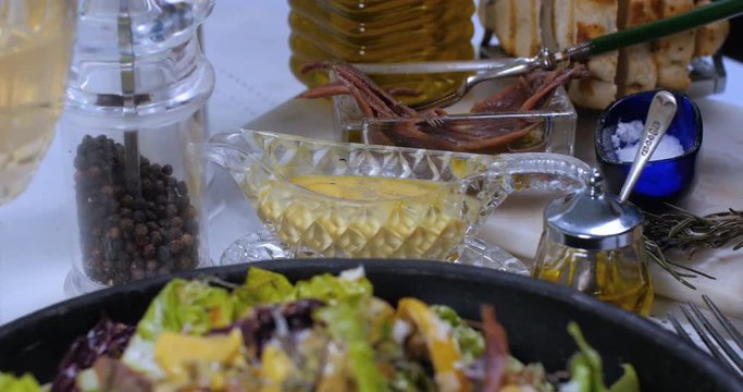 Dolly close up push out view of a delicious Caesar's salad